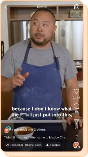 david chang wearing blue apron talking about food in kitchen