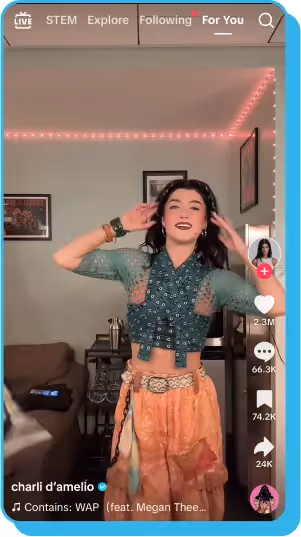 TikTok video of a creator dancing in a decorated room, wearing a green top and orange skirt