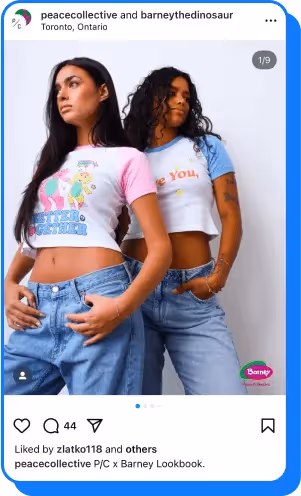 Two women wearing Peace Collective x Barney graphic tees and jeans