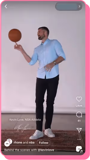 Man in dress shirt and sneakers spins basketball in minimal studio setting