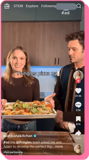 Creator presenting Pringles pizza in paid TikTok ad with Adam Brody