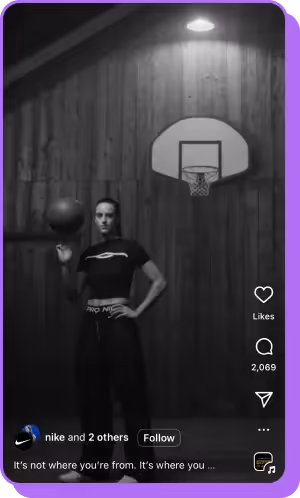 Woman in Nike gear holding basketball in moody black-and-white gym scene