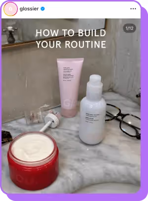 Glossier skincare products on marble counter with “How to Build Your Routine” text