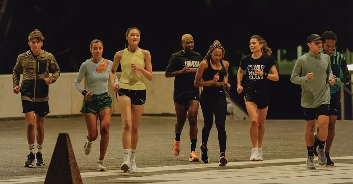 Diverse runners training at night, capturing authentic UGC content for Dash Social campaigns