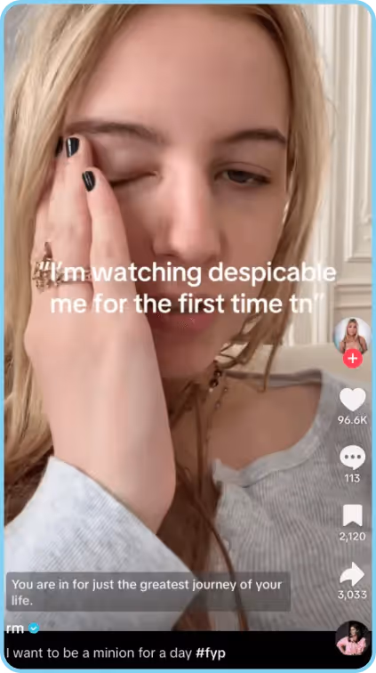 Young woman holding face, reacting to watching Despicable Me for the first time.