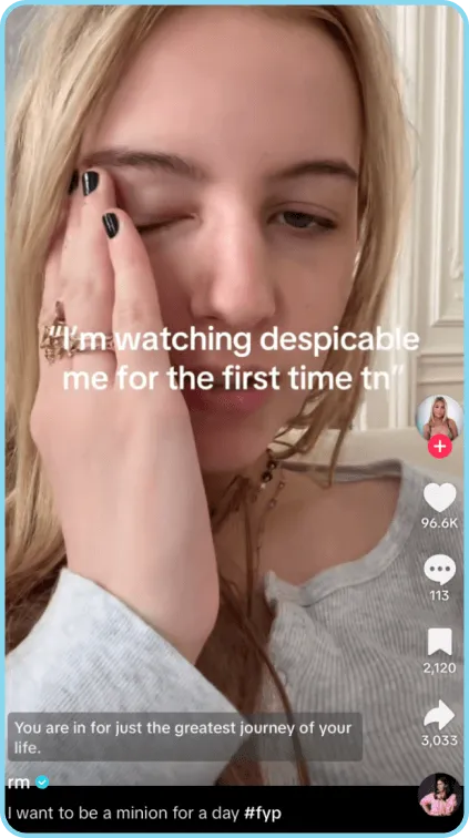 Young woman holding face, reacting to watching Despicable Me for the first time.