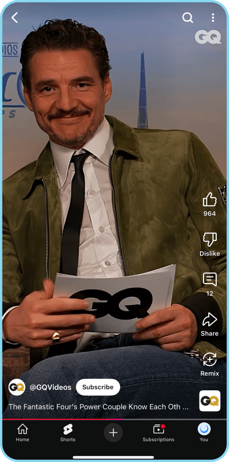 YouTube Shorts video with a Pedro Pascale holding a branded card.