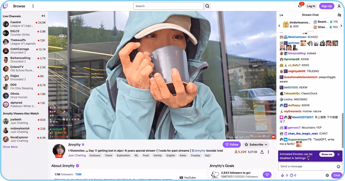 Twitch livestream of Jinnytty drinking from a mug with active chat sidebar.