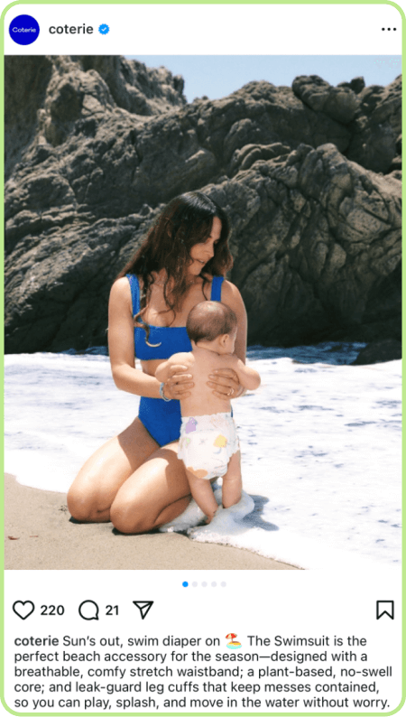 Instagram photo of woman in blue swimsuit holding baby at beach shoreline.
