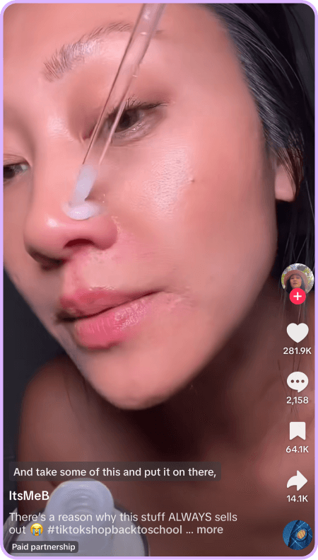 Close-up of woman applying skincare serum with dropper in TikTok video tutorial