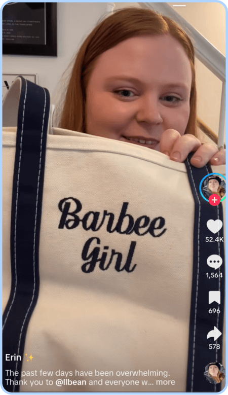 Woman holding tote bag embroidered with “Barbee Girl” in viral TikTok.