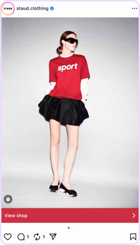 Model in red sport tee and black mini skirt posing against white background