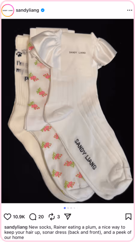 Three Sandy Liang socks with ribbon, floral, and text designs featured in an Instagram post