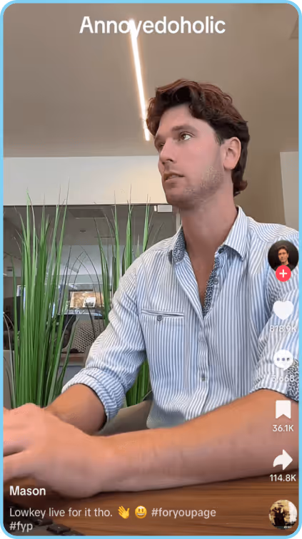 Man working at desk with a serious expression in modern office setting