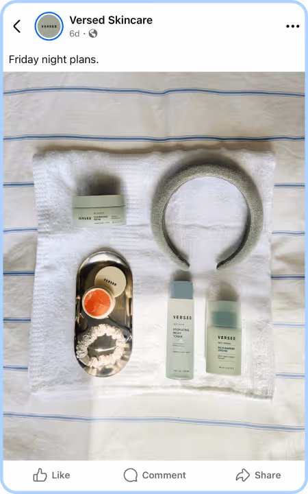 Flat lay of Versed Skincare products and spa accessories on a white towel background.