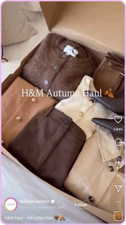 Box filled with folded fall clothes from H&M including coats and bags