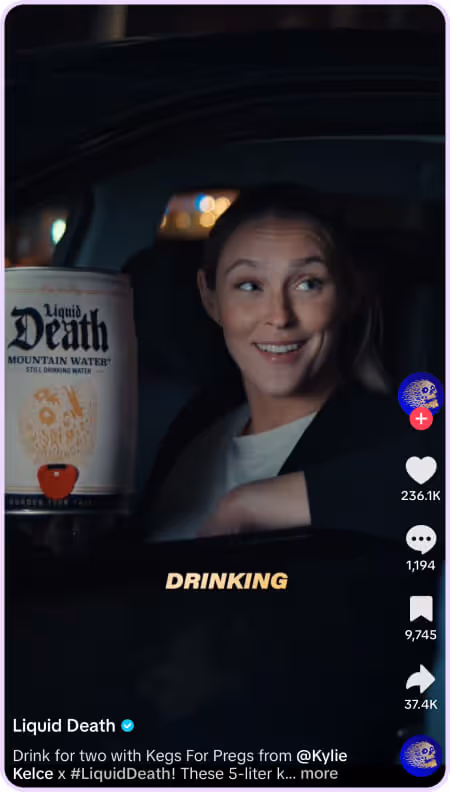 Woman smiling in car holding oversized Liquid Death can in TikTok with high engagement