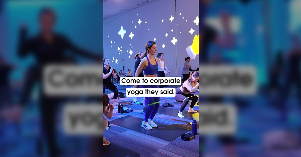 Women in activewear doing yoga during a corporate fitness class for a LinkedIn video
