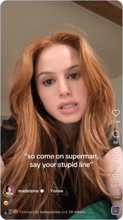 Red-haired woman speaking directly to camera with quote text over video.