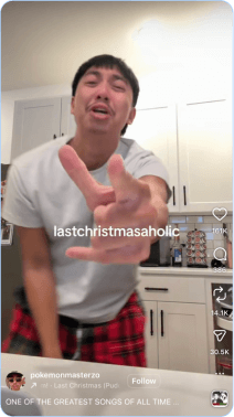 Man in festive pajamas dancing in kitchen to Last Christmas song