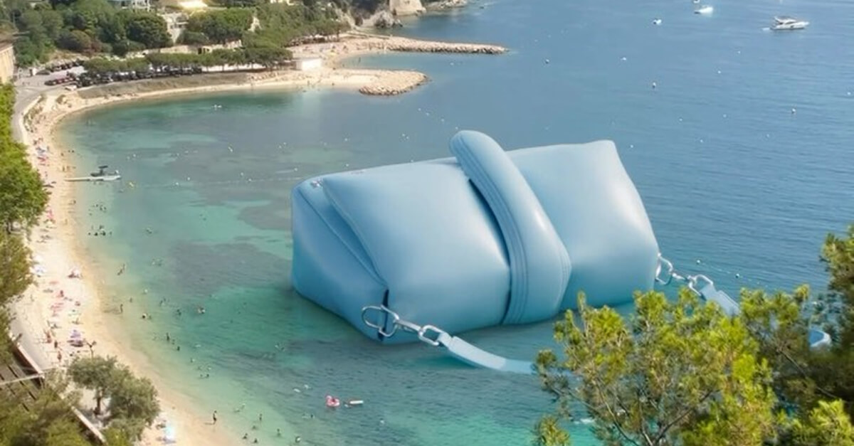 Oversized blue handbag floating in ocean near beach, promoting AI marketing