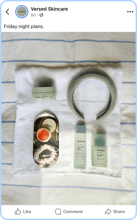 Flat lay of Versed Skincare products and spa accessories on a white towel background.