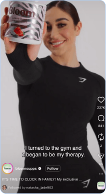 Leana Deeb holding Bloom pre-workout container