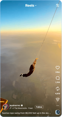 Person sunrise rope swinging from 96,000 feet above clouds and landscape