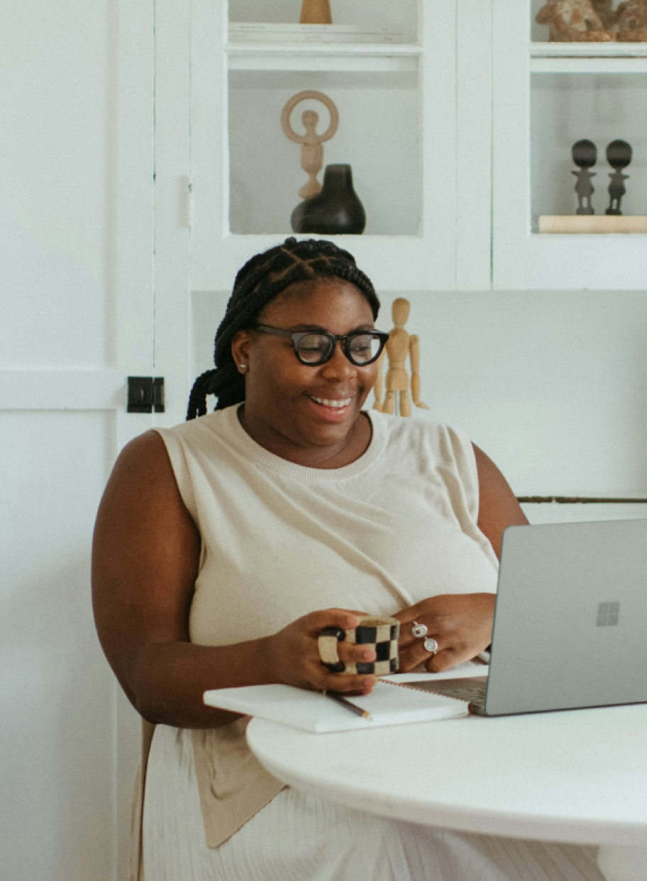 A woman is looking at computer