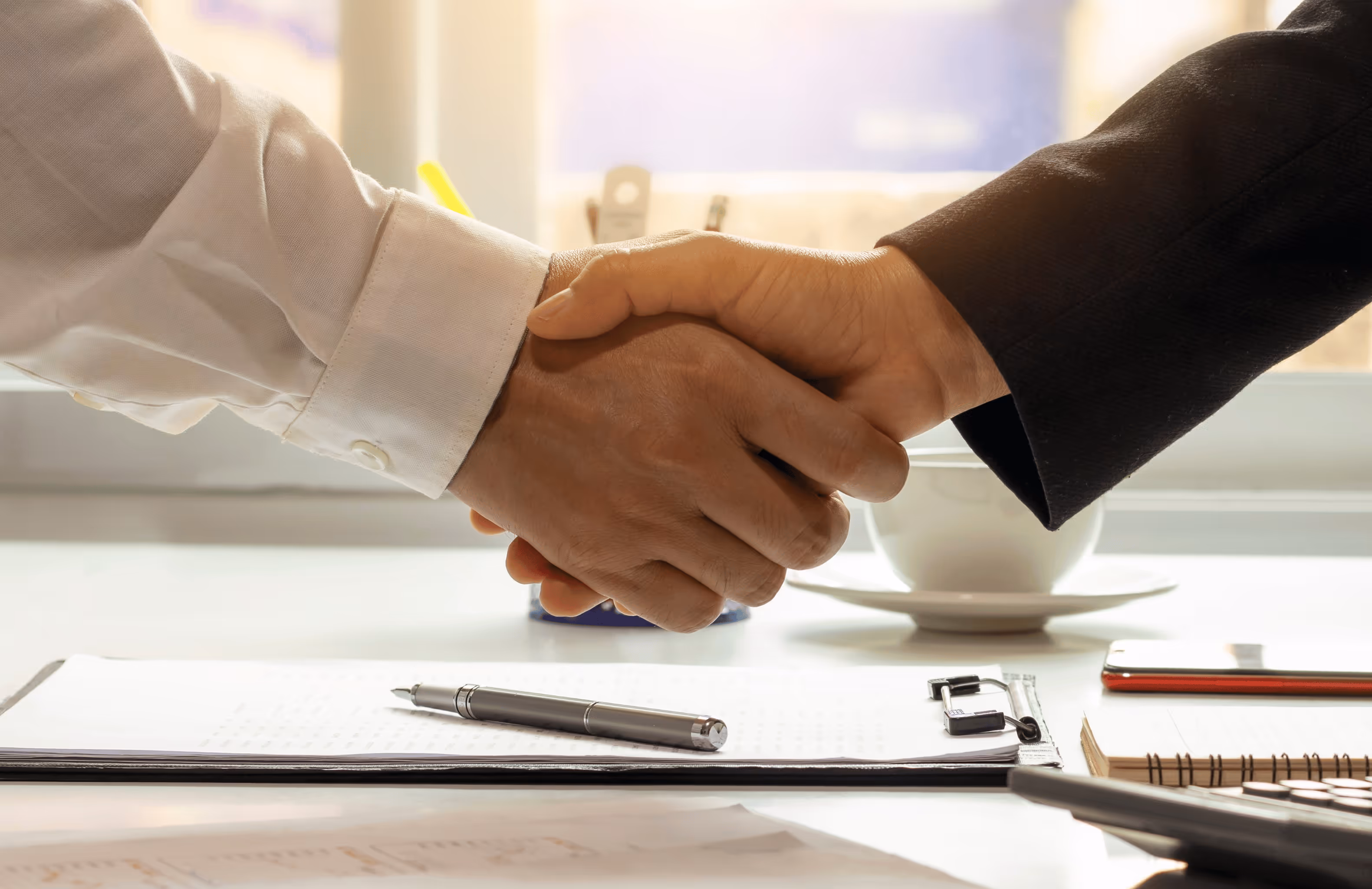 logistics company kuzu logistics shaking hands