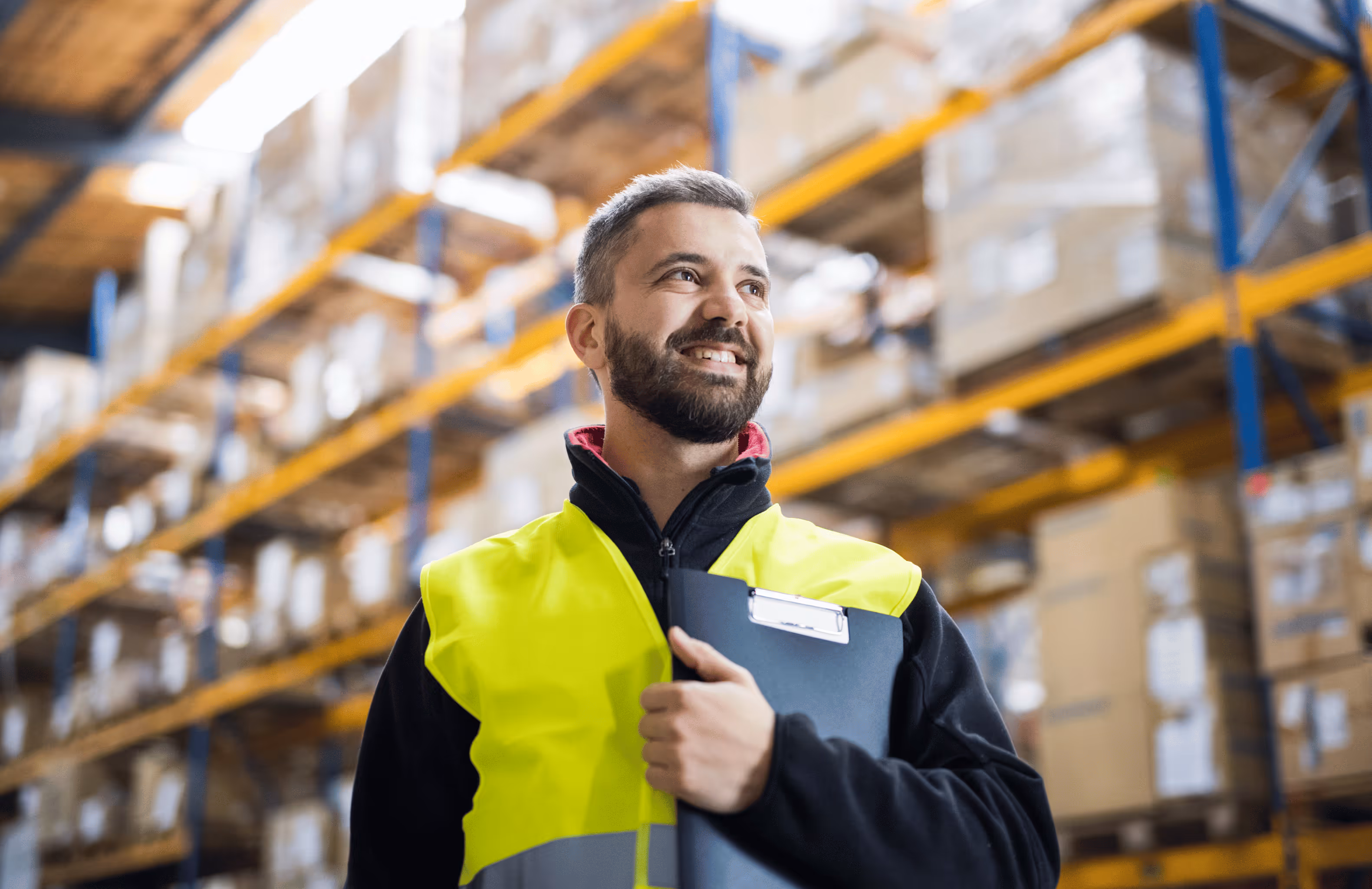 fast deliveries, man standing in a warehouse 