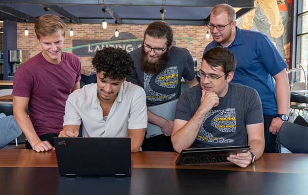 Image of Wavetronix Employees surrounding a laptop