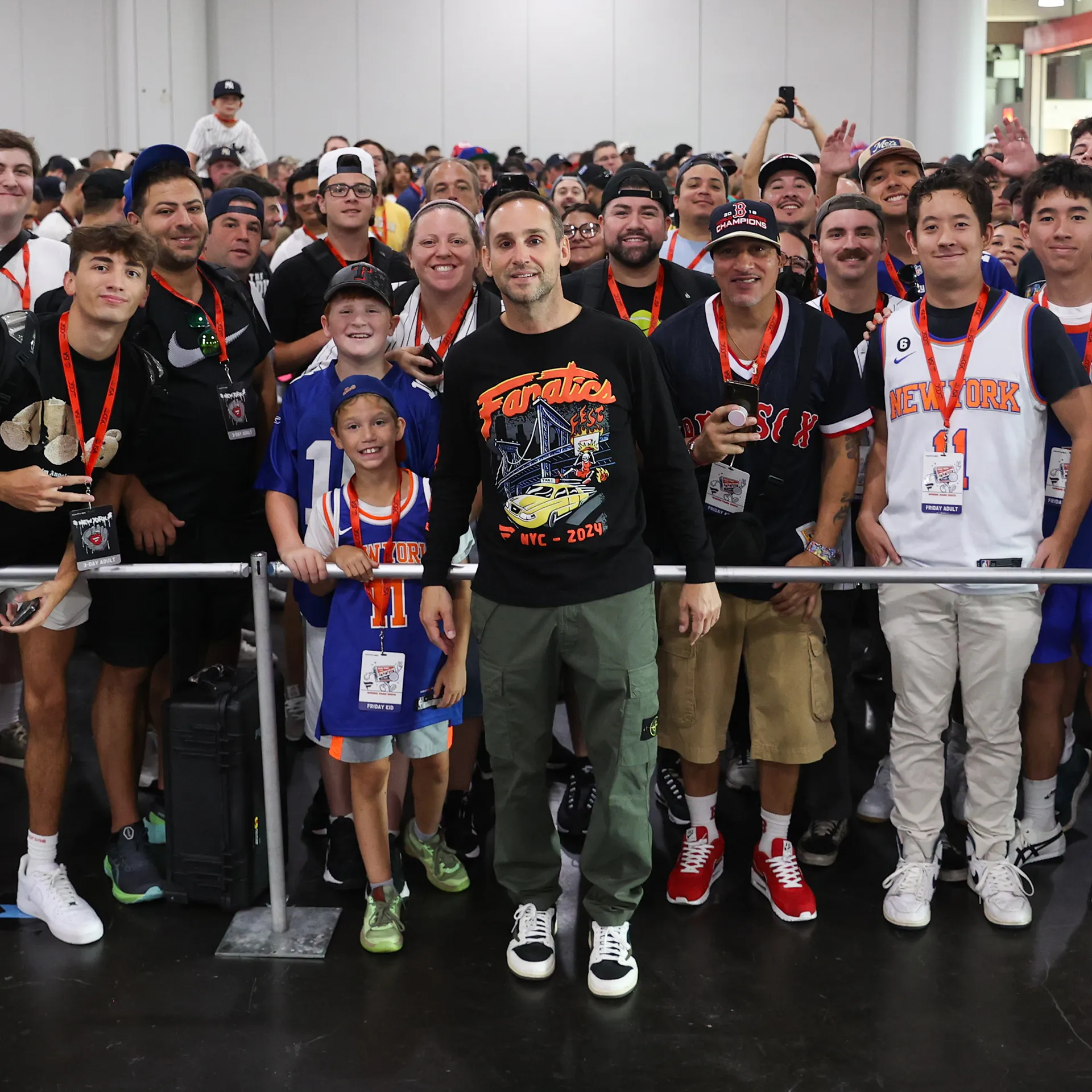 Michael Rubin stands with fans and attendees of Fanatics Fest