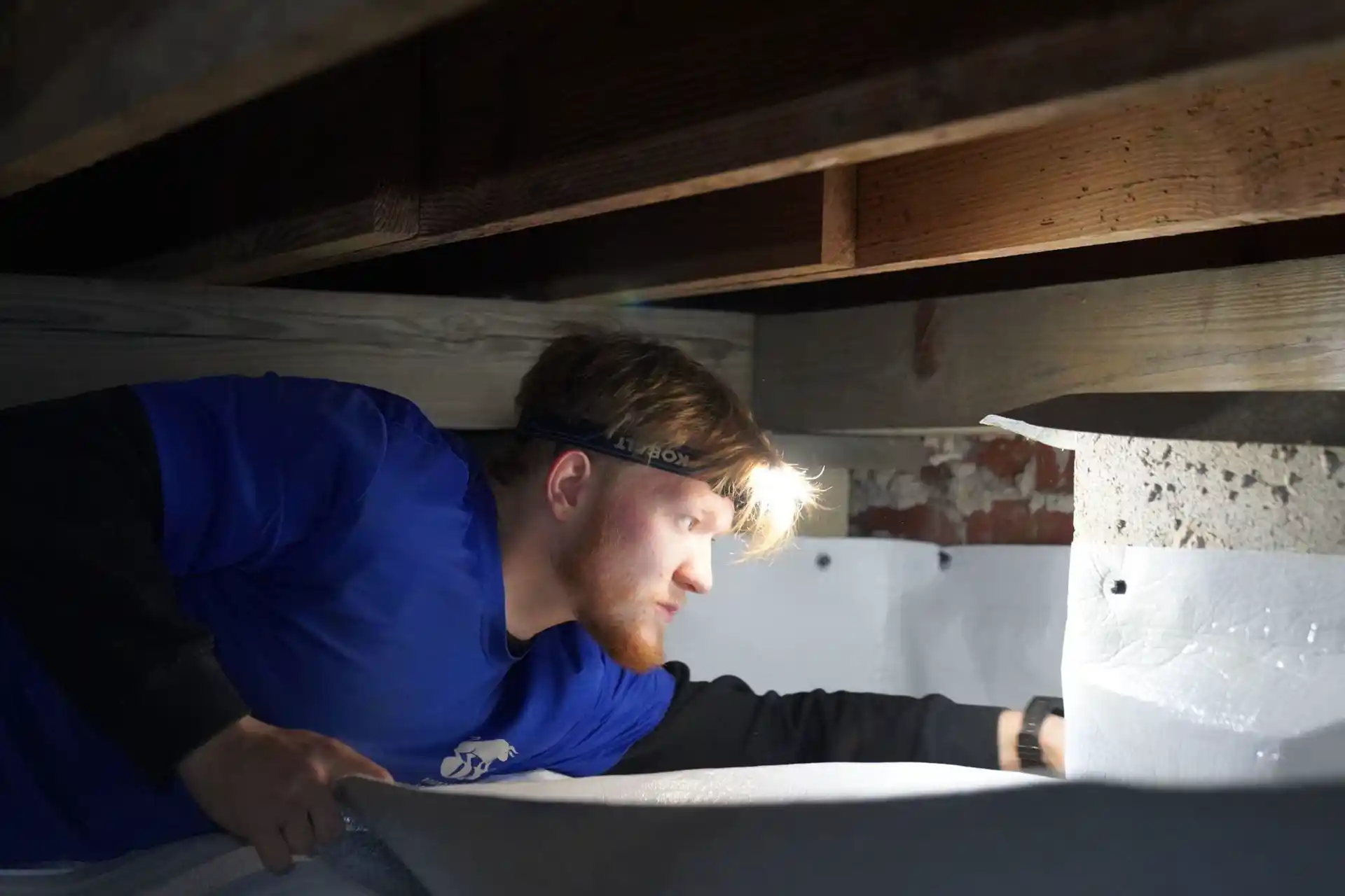 Crawl space conversion service transforming dirt crawl space into clean usable area in Alabama home