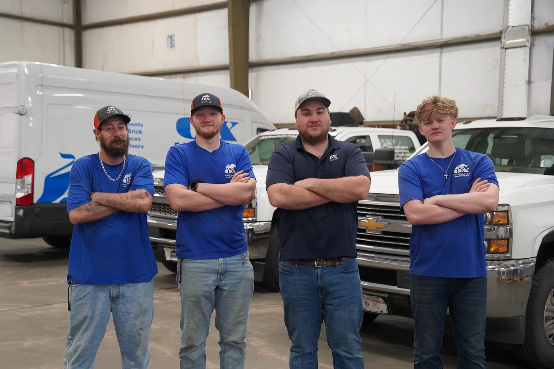 Foundation repair technicians and crew members working at Alabama job site representing Ox careers opportunities