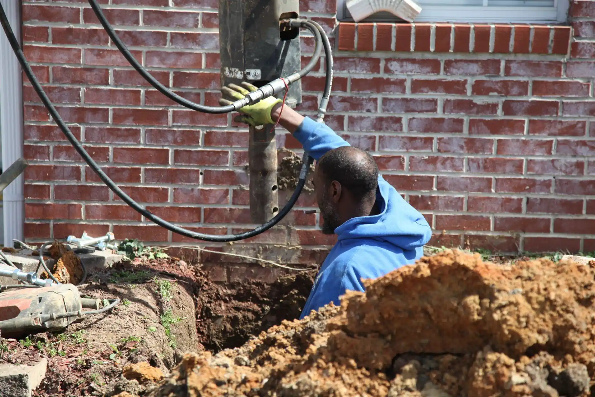 Foundation wall repair and reinforcement service using carbon fiber or steel anchors in Alabama home