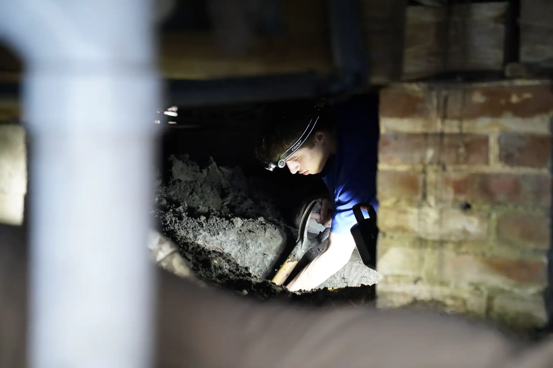 Crawl space waterproofing system with drainage matting and sump pump protecting Alabama home from moisture