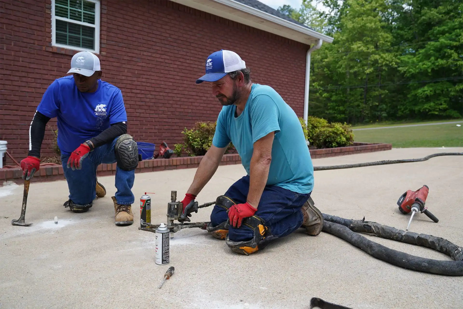 Sunken and uneven driveway concrete lifting and leveling repair service by Ox Foundation Solutions Alabama