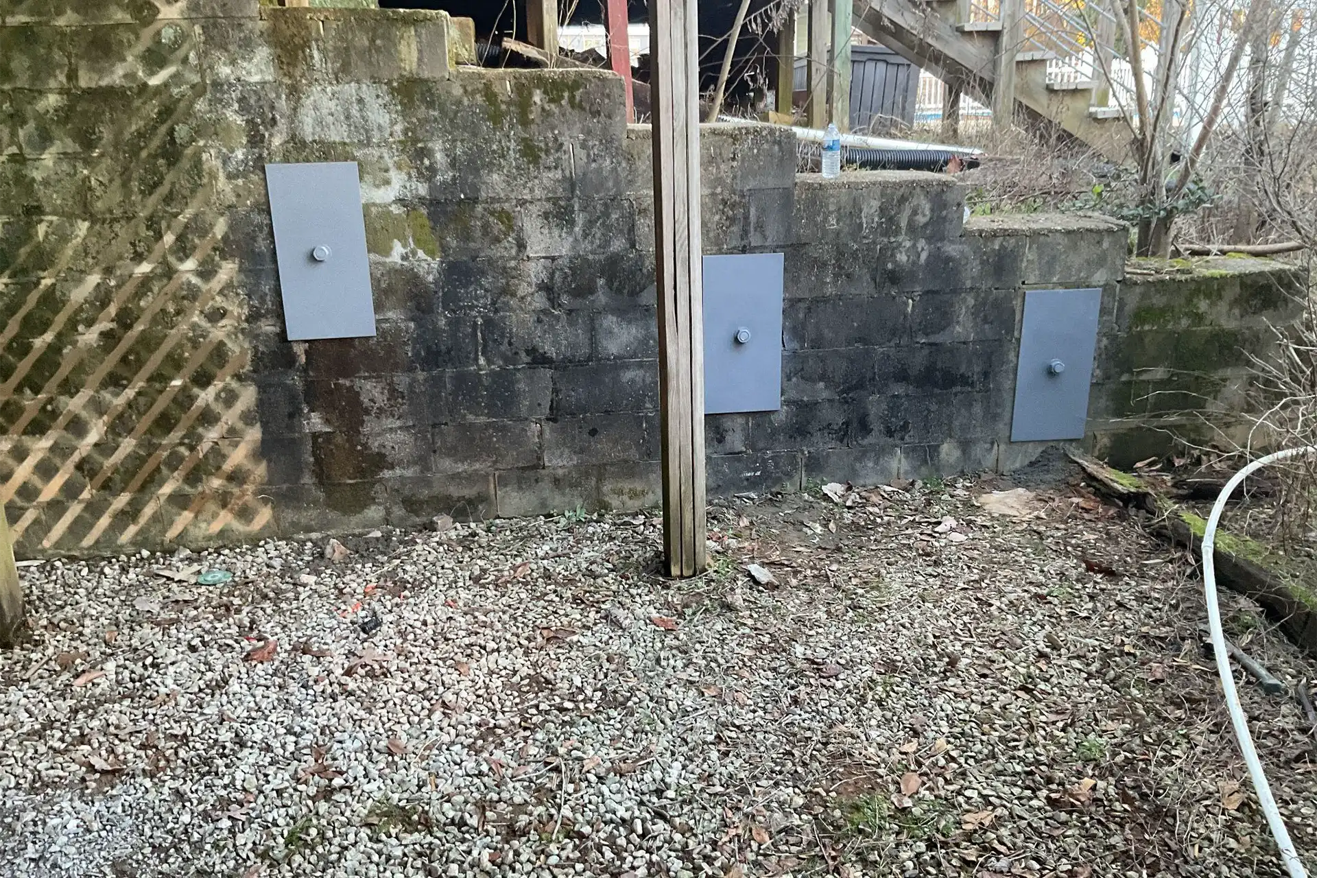 Helical tieback anchor system installation for bowing wall repair and stabilization in Alabama home