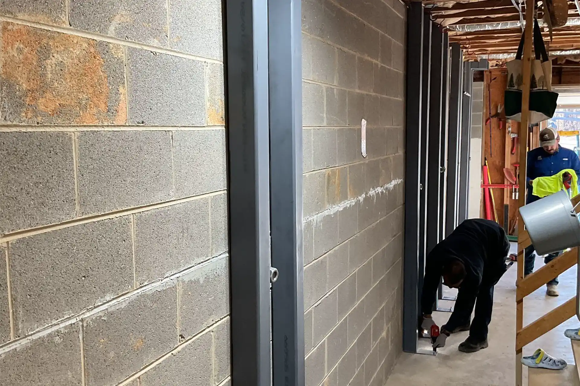 Basement wall waterproofing panel system installation protecting Alabama home from water and moisture damage