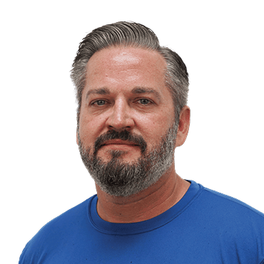 Ox Foundation Solutions technician portrait wearing a blue shirt with gray beard and hair, headshot for team/about page