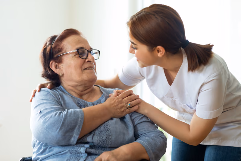 A young lady talking to an older lady