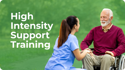Healthcare worker kneeling and holding hands with an elderly man in a wheelchair outdoors with text 'High Intensity Support Training'.