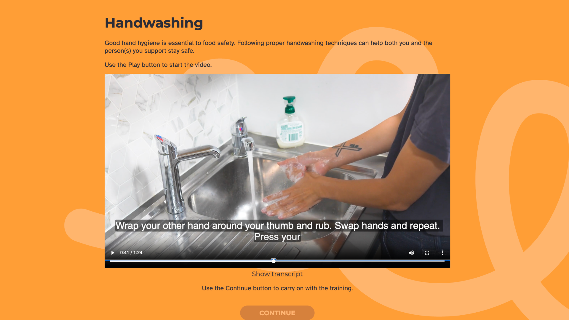 Handwashing' lesson screen explaining that good hand hygiene is essential to food safety, with an embedded video showing a person lathering and washing their hands under running water at a kitchen sink.