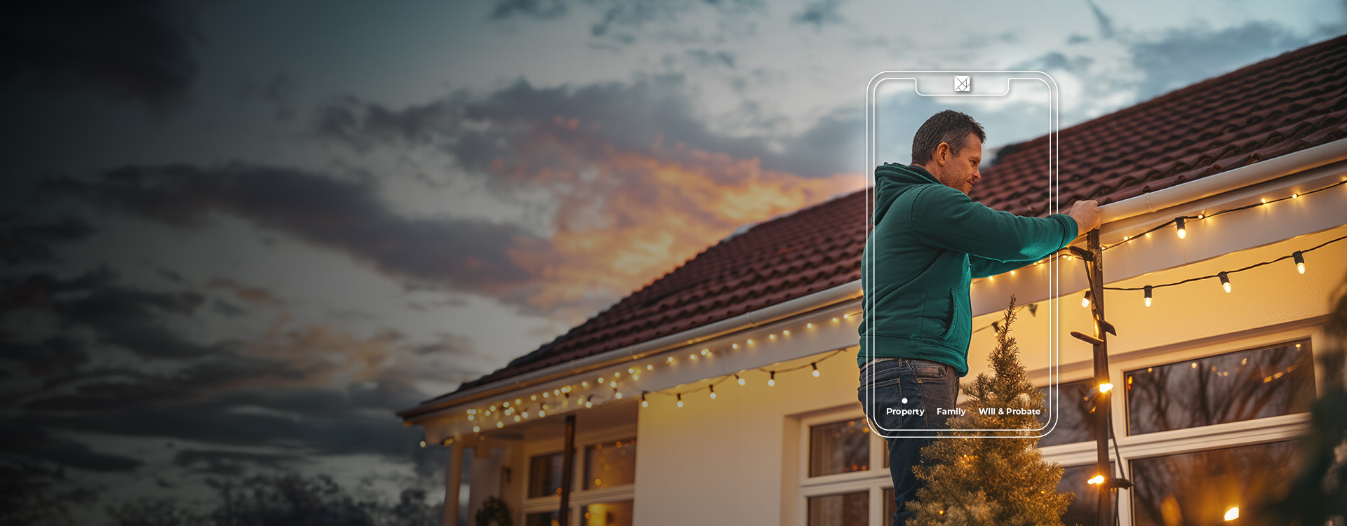Man putting lights up on house exterior