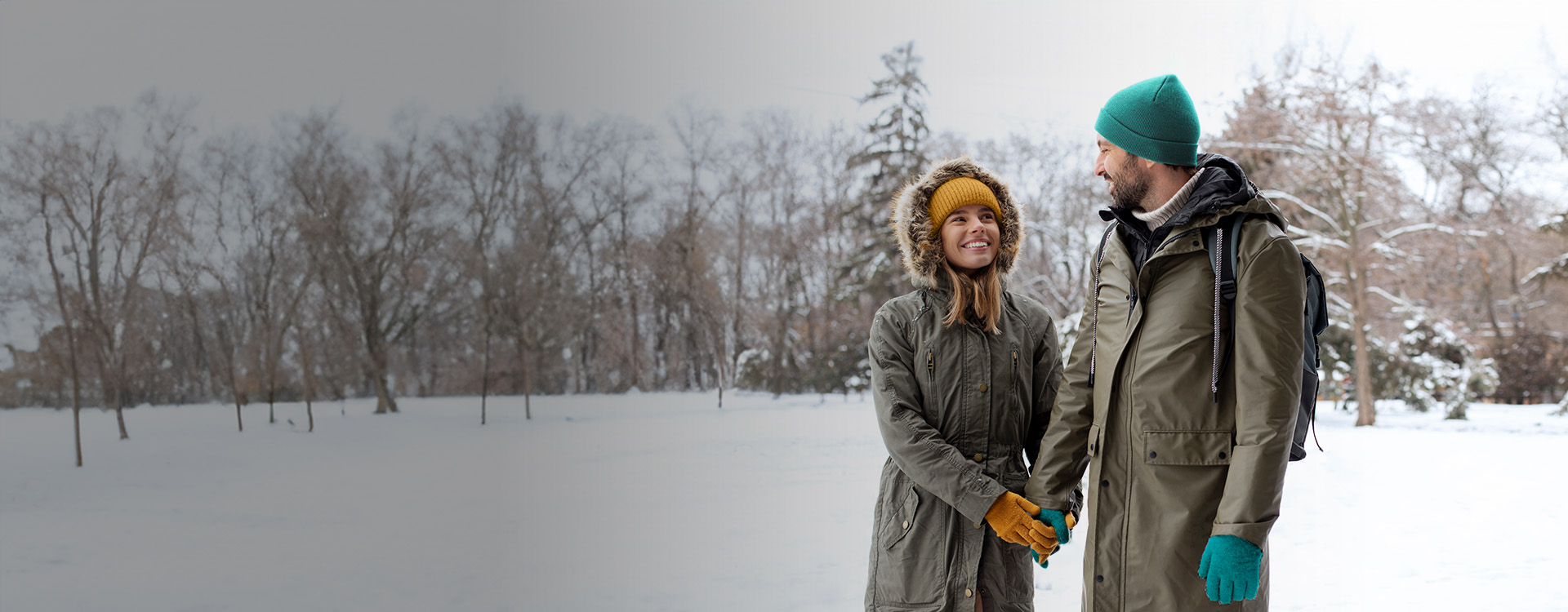 Couple holding hands in the snow