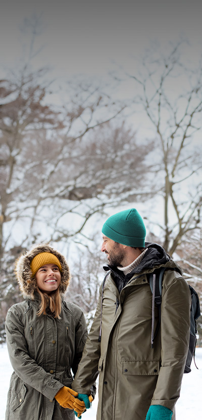 Couple holding hands in the snow