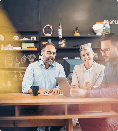 Team on a table with two man and one woman.