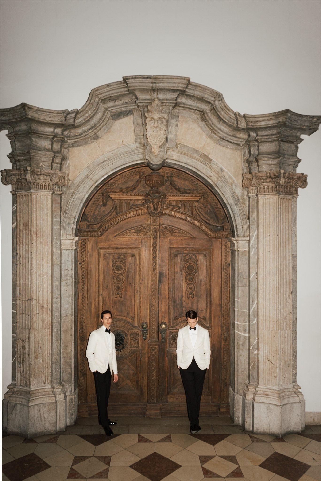 Two grooms with wedding rings — bespoke destination wedding visual identity by Wedding Mark