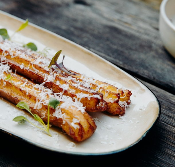 A snack menu to share at the PLANB hotel in Chamonix, offering tasty options in a refined alpine setting.